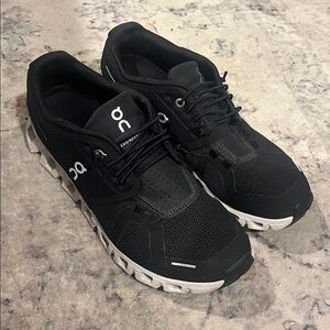 On Running Black and White Athletic Shoes with Cloud-Like Sole